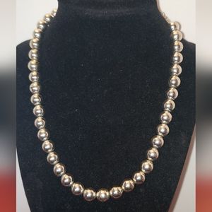 1928 jewelry silver tone metal beaded necklace on chain.
